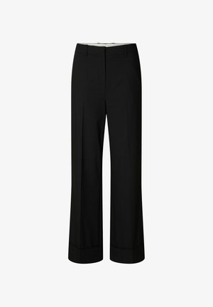 Pantalons larges noirs en tissu lisse, dotés d'une taille cintrée et de plis nets. Les ourlets sont soigneusement repliés sans qu'aucune quincaillerie ne soit visible.