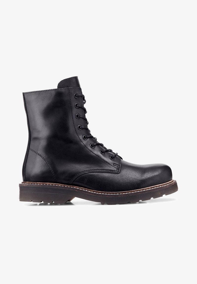 Bottine noire en cuir à lacets avec une semelle marron robuste et un bout arrondi, conçue pour la durabilité et le style.