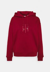 Czerwona bluza z kapturem, z haftowanym z przodu logiem Tommy Hilfiger, z regulowanym kapturem oraz ściągaczami na rękawach i u dołu, zaprezentowana na jednolitym tle.