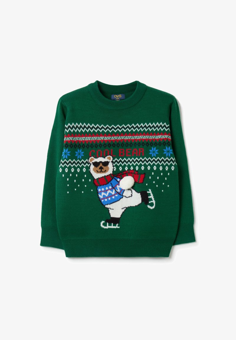 Pull en tricot vert avec un ours sur des patins à glace, vêtu d'un pull bleu et d'une écharpe rouge, orné de motifs de flocons de neige et en zigzag.