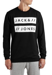 Sudadera negra de algodón, con un gráfico blanco que lleva el texto "JACK&//JONES" en la parte delantera. Mangas largas y puños de canalé.
