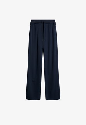 Navy levelee lahkeet, jotka on valmistettu pehmeästä kankaasta, jossa on joustava vyötärö, jossa on kiristysnyöri, sekä sivutaskut. Suora rakenne, rento muotoilu.