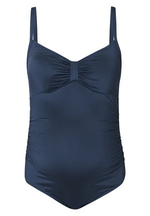 Costume da bagno intero blu navy con spalline regolabili, dettaglio frontale arricciato e arricciature laterali. Tessuto morbido e liscio. Senza motivi né accessori.