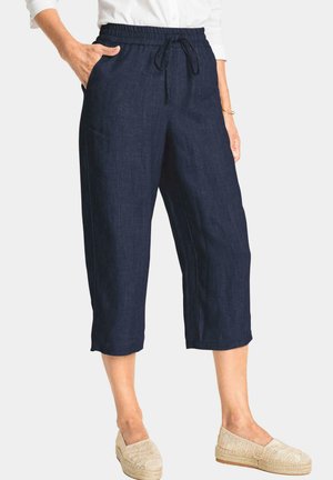 Pantalons cropped en lin bleu marine avec une taille élastique, un détail à cordon de serrage et des poches latérales. Texture douce et coupe décontractée.