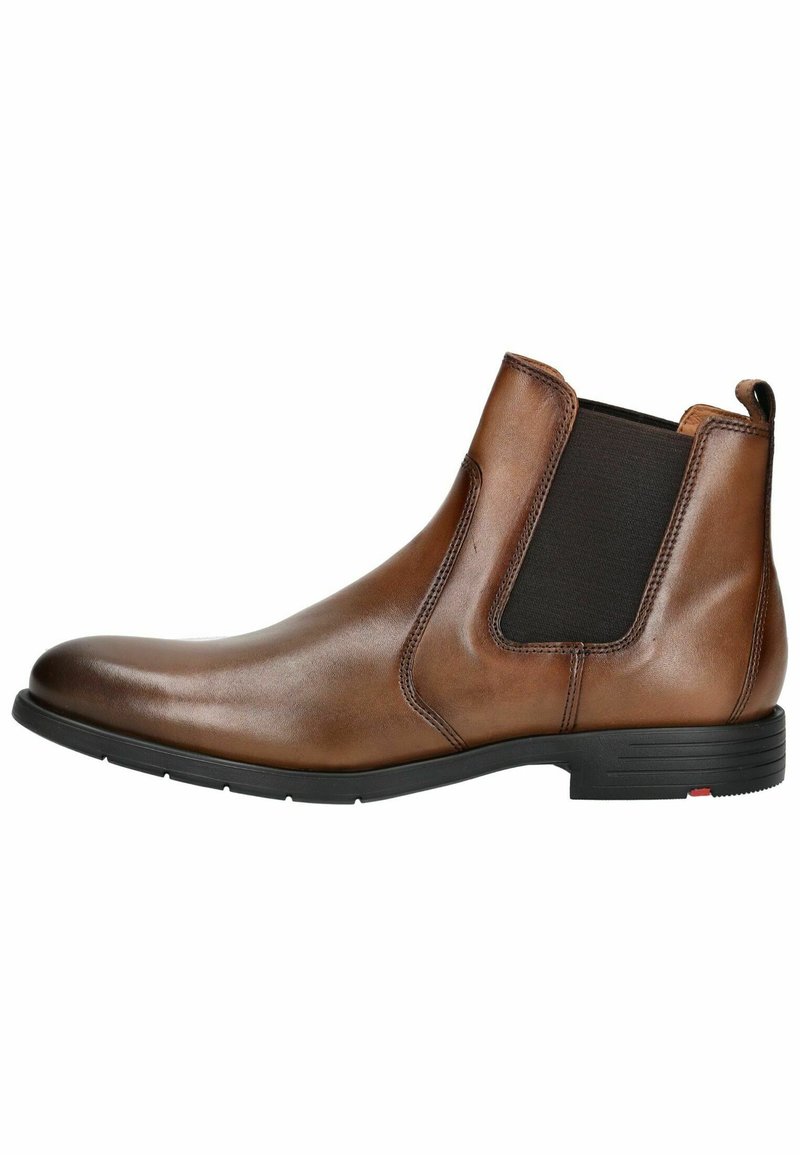 Braune Leder Chelsea-Boots mit elastischen Seitenpanelen, runder Zehenpartie und niedrigem Gummihacken. Glatte Textur mit dezentem Glanz.