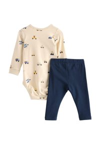 Body à manches longues beige avec imprimés de véhicules, associé à des leggings bleu marine. Matière en coton doux, coupe ajustée et taille élastique.