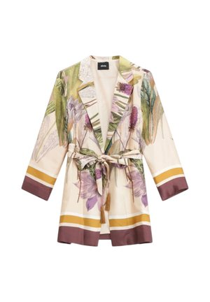 Blazer floreale beige chiaro con stampa botanica verde e viola, dettagli a righe senape e marroni e cintura annodata in vita con nappine.