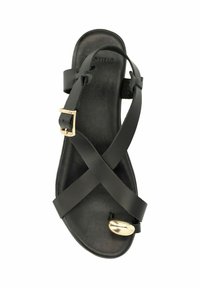 Black sandal with crisscross straps made of smooth leather, featuring a shiny gold accent at the toe and a side buckle for adjustment.