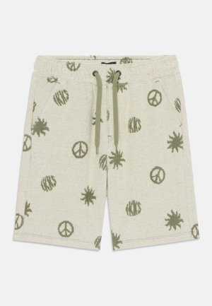 Beige shorts med snøre i taljen med grønne fredstegn, sole og stribede cirkelmønstre, med sidelommer og elastik i taljen.