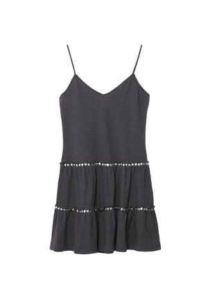 Black sleeveless dress with thin straps, tiered skirt, and rows of small reflective sequins on each tier.