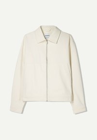 Cream-colored zip-up jacket made of textured fabric, featuring a pointed collar, two front pockets, and long sleeves with cuff detailing.