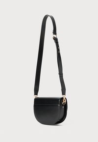 Black leather crossbody bag with a rounded bottom, adjustable strap, and gold hardware accents. Smooth texture and minimalistic design.