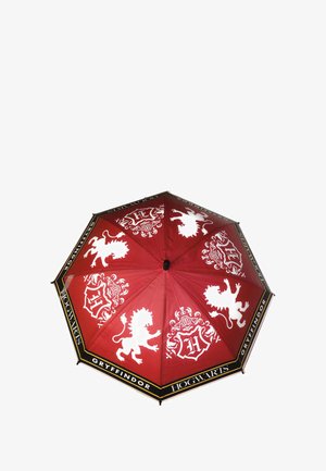 Red umbrella featuring white Gryffindor lion designs and Hogwarts text. Hexagonal shape with a smooth fabric finish and black trim.