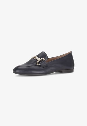 Black leather flat loafer with gold metal horsebit detail, rounded toe, and slightly raised heel on white background.