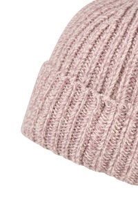 Close-up of soft ribbed knit beanie in pale pink and cream tones, folded at the edge.