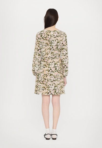 Floral dress with long sleeves, featuring a light cream background, pink and green flower patterns, and a cinched waist design.