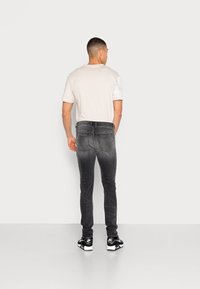 Diesel SLEENKER - Calças de ganga de corte skinny - 0eiag 02