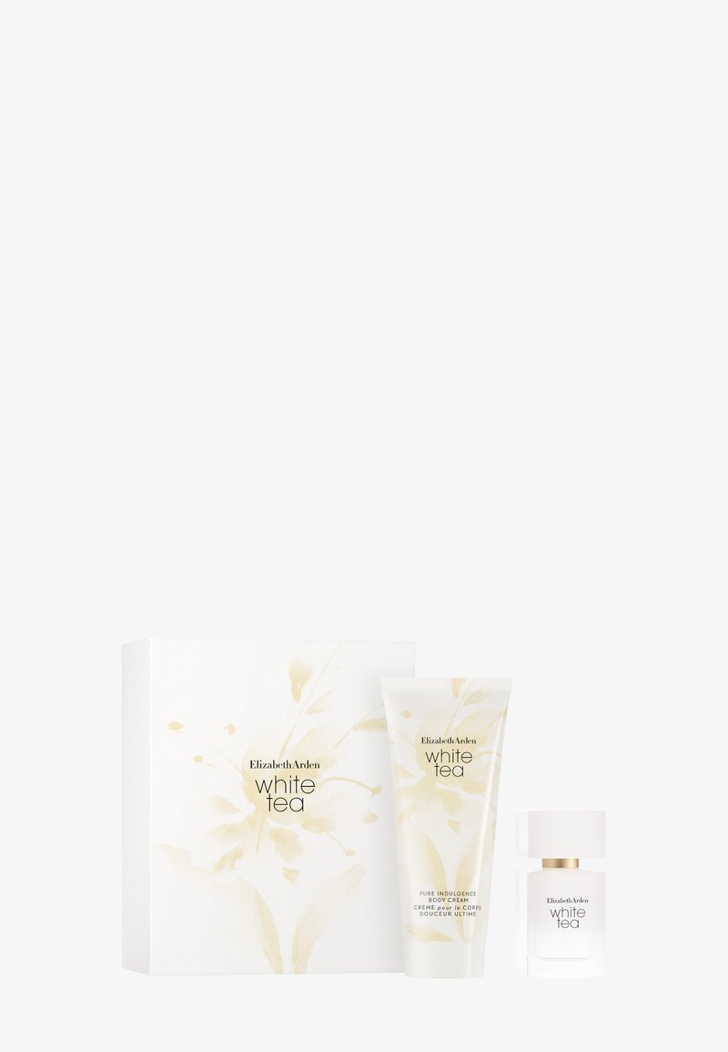 Zestaw prezentowy zawierający biały pudełko z złotymi kwiatowymi akcentami, kremową tubkę i szklaną butelkę, wszystkie oznaczone jako "White Tea" autorstwa Elizabeth Arden.