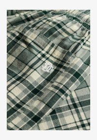 Non sélectionné, green check