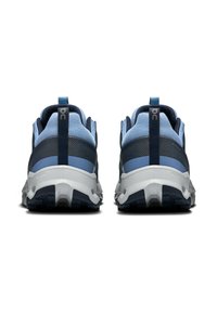 Blue and navy athletic shoes with mesh upper, textured accents, cushioned white midsole, and rugged black outsole. Features pull tab.