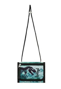 Borsa a tracolla nera con uno scheletro di dinosauro dipinto su uno sfondo color turchese, dotata di una tasca con zip e di una tracolla regolabile.