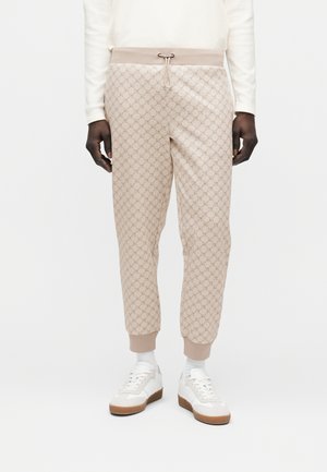 ELITON - Tracksuit bottoms - taupe