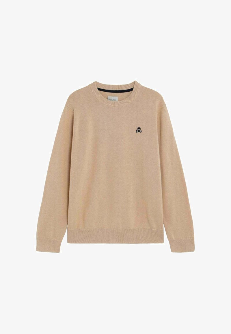 Pull beige à manches longues avec col rond, poignets et ourlet côtelés, présentant un petit emblème noir de tête de mort et os croisés sur le côté gauche de la poitrine.