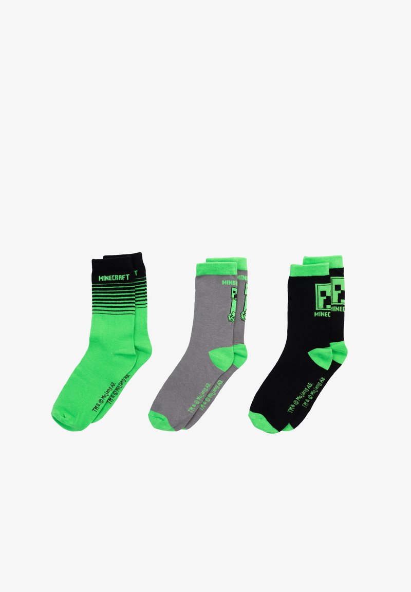 Three pairs of Minecraft-themed socks: black with green accents and stripes, gray with green heel and toe, and solid green with black accents.