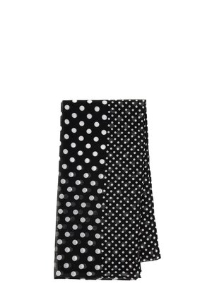 Écharpe noire avec un motif à pois, présentant de grands pois blancs d'un côté et des pois plus petits de l'autre, en tissu texturé, de forme rectangulaire.