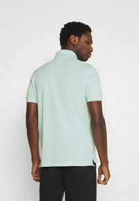 Tommy Hilfiger REGULAR - Polo - oxygen