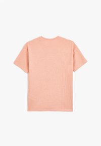 Kortærmet, ribbet T-shirt i lys ferskenfarve. Har en klassisk rund halsudskæring og et struktureret stof for komfort.