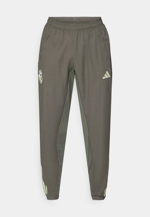 Gray athletic pants with an elastic waistband, featuring a textured finish and contrasting green side accents. Includes a logo detail.