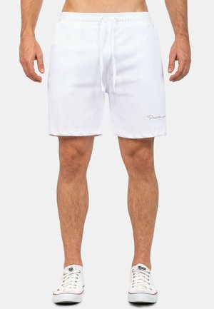 Witte katoen shorts met een elastische taille en trekkoord. Voorzien van zijzakken en een minimalistisch logo op de zoom. Casual fit.