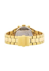 Reloj de acero inoxidable dorado con pulsera de eslabones, caja redonda, tres pulsadores y cierre desplegable. Fondo de caja transparente visible.