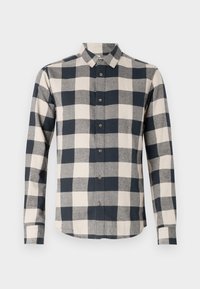 Lange mouwen knoopshirt met zwart-wit vierkant patroon en een klassieke kraag.