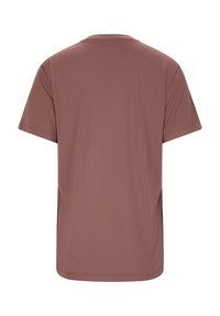 T-shirt med kort ärm i dammig rosafärg, slät textur, rundad halsringning, inga mönster, enkel design, måttlig stretch, lätt figursydd siluett.