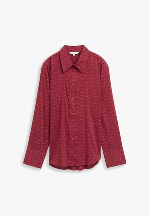 Red long-sleeve shirt featuring a collar and a button-down front. Patterned with small, abstract designs throughout on a smooth fabric.