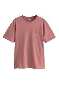 Kurzärmeliges, rundhalsiges T-Shirt in staubrosa Farbe, aus weichem Stoff gefertigt, mit einem kleinen Logo-Akzent auf der linken Brustseite.