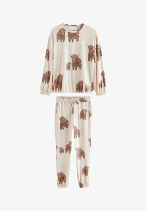 Pyjama set in zachte crème stof met een bruin olifantenpatroon. Het topje heeft lange mouwen en een elastische onderrand; de broek heeft een elastische tailleband en zakken.