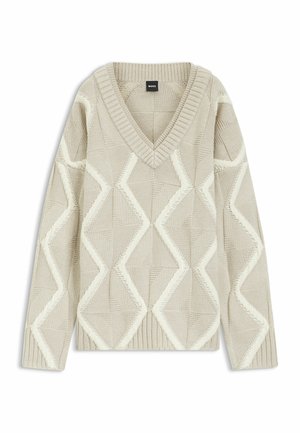 Beige gebreide trui met een V-hals, voorzien van een gestructureerd diamantenpatroon in gebroken wit. Lange mouwen en geribde manchetten en zoom.