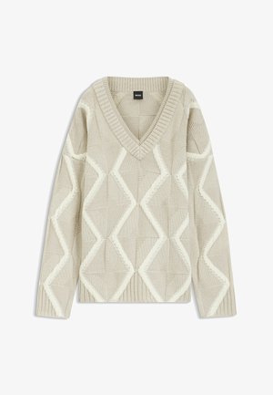 Beige gebreide trui met een V-hals, voorzien van een gestructureerd diamantenpatroon in gebroken wit. Lange mouwen en geribde manchetten en zoom.
