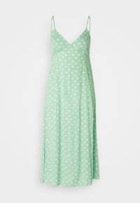 Vestido verde claro hecho de una tela suave, con tirantes ajustables y un patrón floral con flores blancas. Silueta en A.