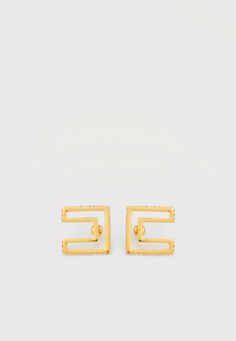 Par majhnih uhancev s kvadratnim zlatim kovinskim zatičem z izrezanim geometrijskim vzorcem na svetlem ozadju.