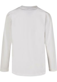 Long-sleeve white shirt made of soft cotton, featuring a round neckline and simple, unembellished design with a straight hem.