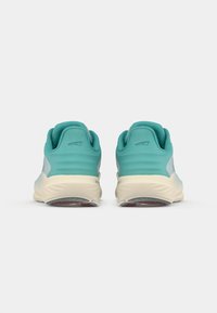 Turquoise running shoes with a smooth texture, contrasting grey accents, cushioned midsole, and a durable outsole featuring red details.