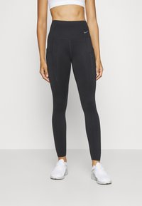 Nike Performance - NIKE GO WOMEN'S FIRM-SUPPORT HIGH-WAISTED 7/8 LEGGINGS WITH POCKETS - Punčochy - black Miniatura obrázku 1