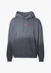 Felpa grigia con effetto ombre sbiadito, coulisse regolabile, tasca frontale e logo rosso Levi's sul petto. Tessuto in cotone, polsini a coste.
