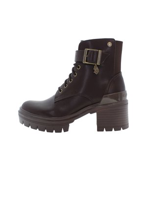 Brown leather ankle boots with a chunky platform sole, laces, a side buckle, and decorative accents. Textured with a smooth finish.