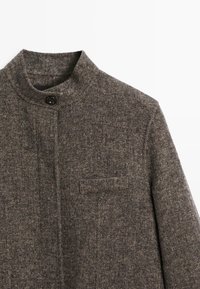 Gray wool jacket with a high collar, textured herringbone pattern, single button closure, and a chest pocket on the left side.