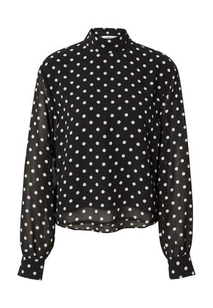 Schwarze Bluse mit weißen Punkten, langen, gepufften Ärmeln und einem hohen Kragen. Der Stoff wirkt leicht und durchsichtig und hat weiße Punkte.